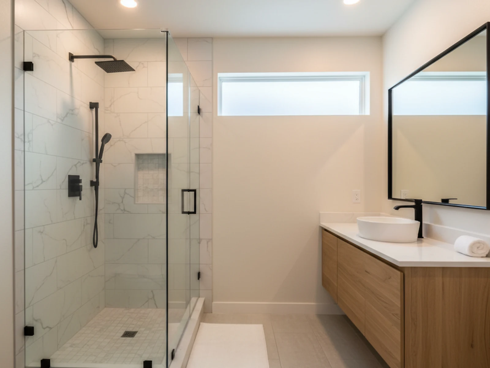 Fully rebuilt spa bathroom with tiled walk-in shower and floating vanity completed by Palm Build